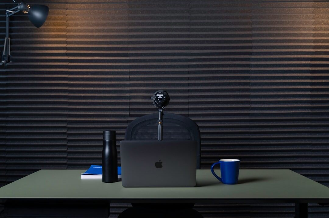 Streaming setup with webcam and encoder software on a laptop
