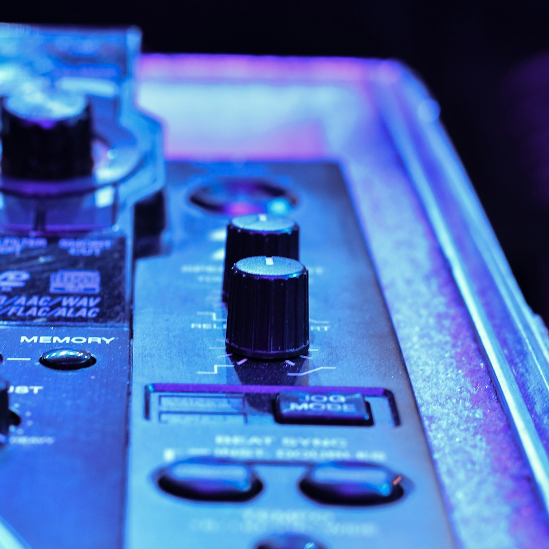 Close-up of a live video production switcher with glowing buttons