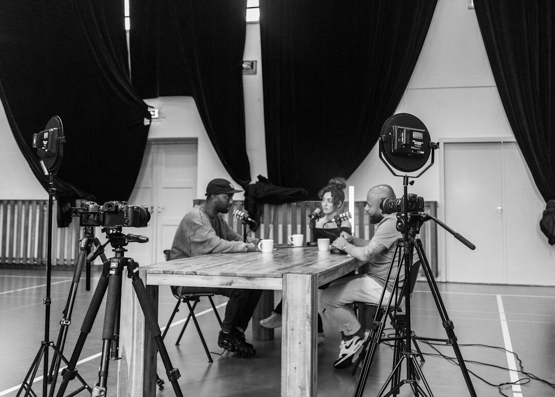 Television studio set with hosts and cameras during a live broadcast