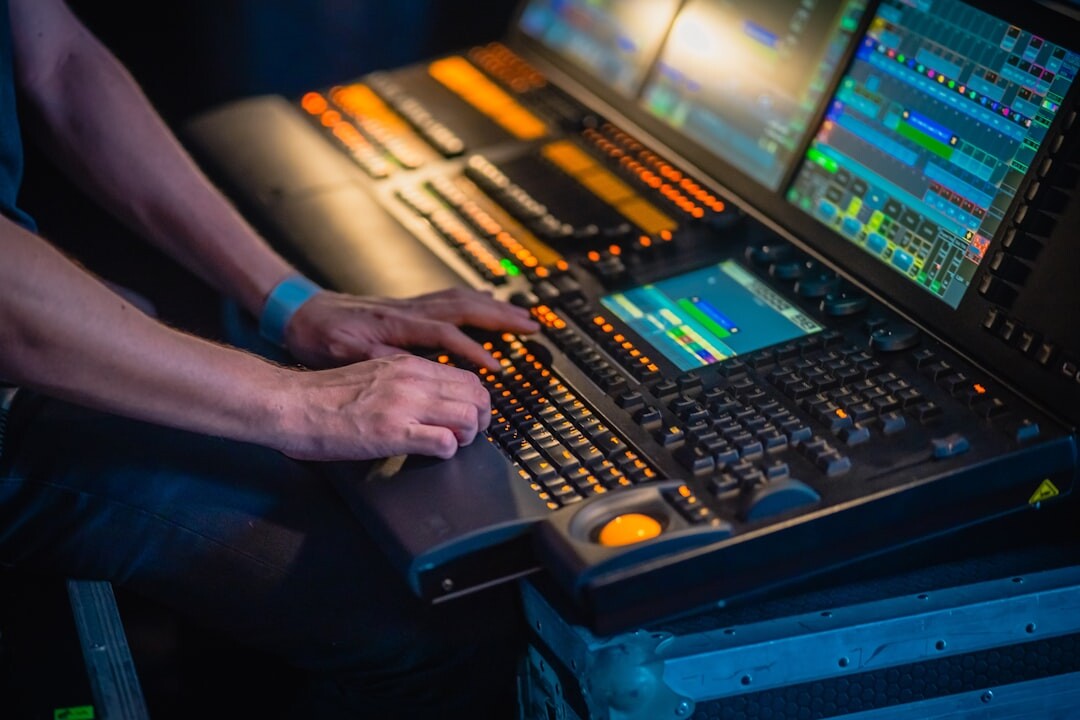 Close-up of hands operating a professional video switcher